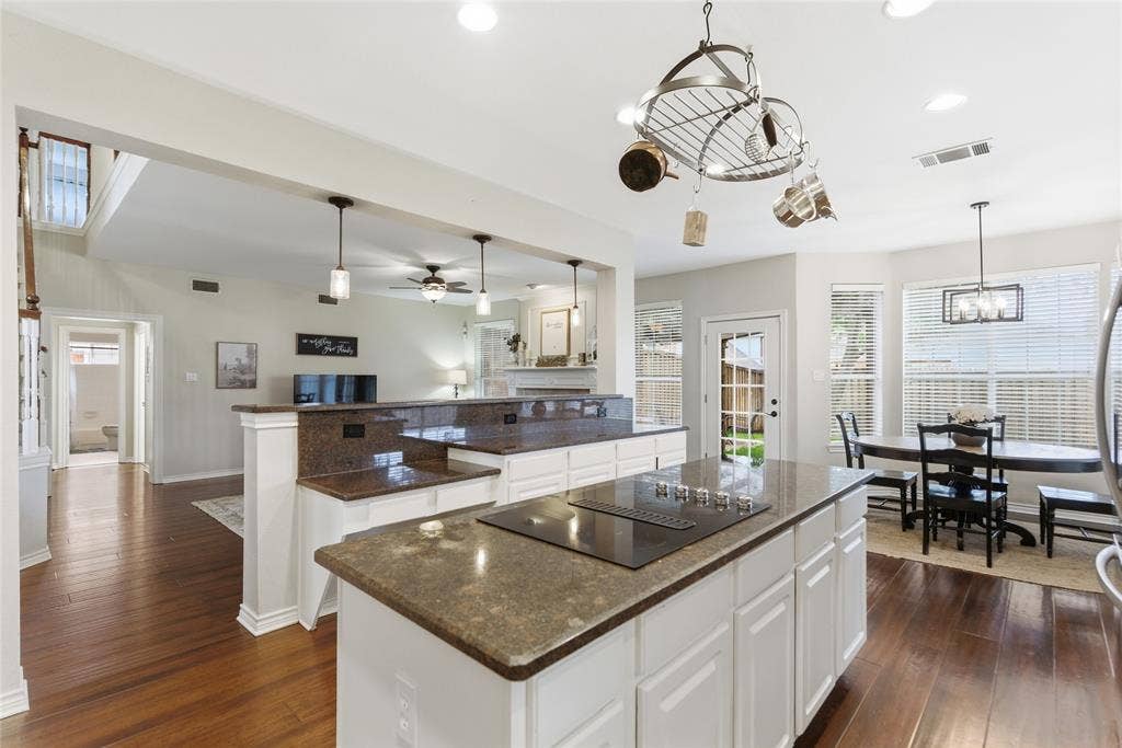 4112 Blackpool Drive, Plano, TX 75093 Kitchen island with integrated cooktop and stone-finish countertop