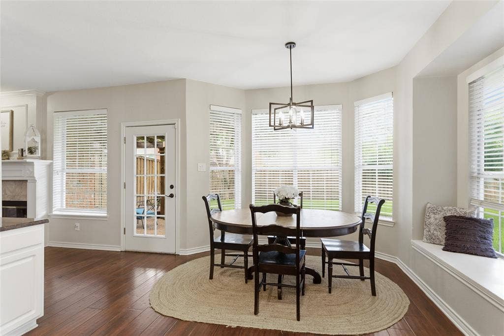 4112 Blackpool Drive, Plano, TX 75093 Dining area featuring wood-finish flooring and a built-in window seat