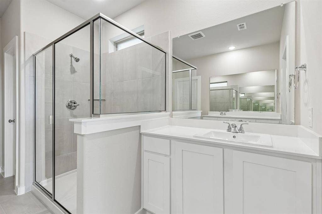 Primary Bathroom in the Winters home plan by Trophy Signature Homes – REPRESENTATIVE PHOTO