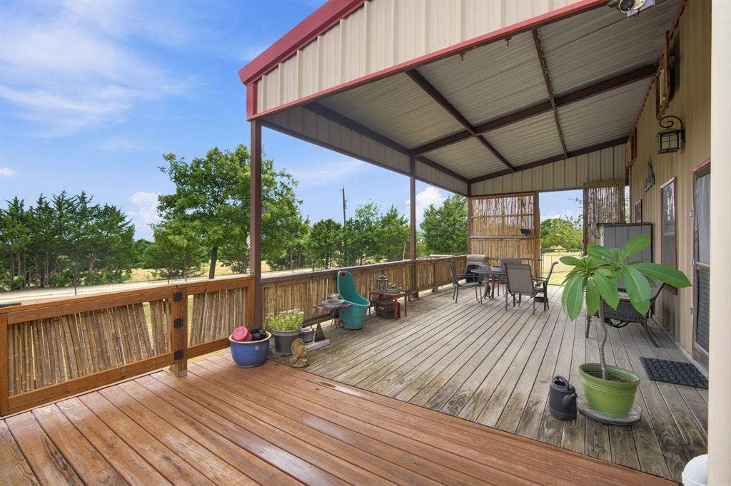 Large back deck is mostly covered and ready for family and friends to gather!