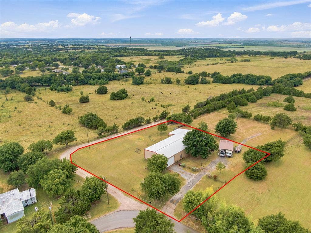 One full acre on a secluded road with open land all around!