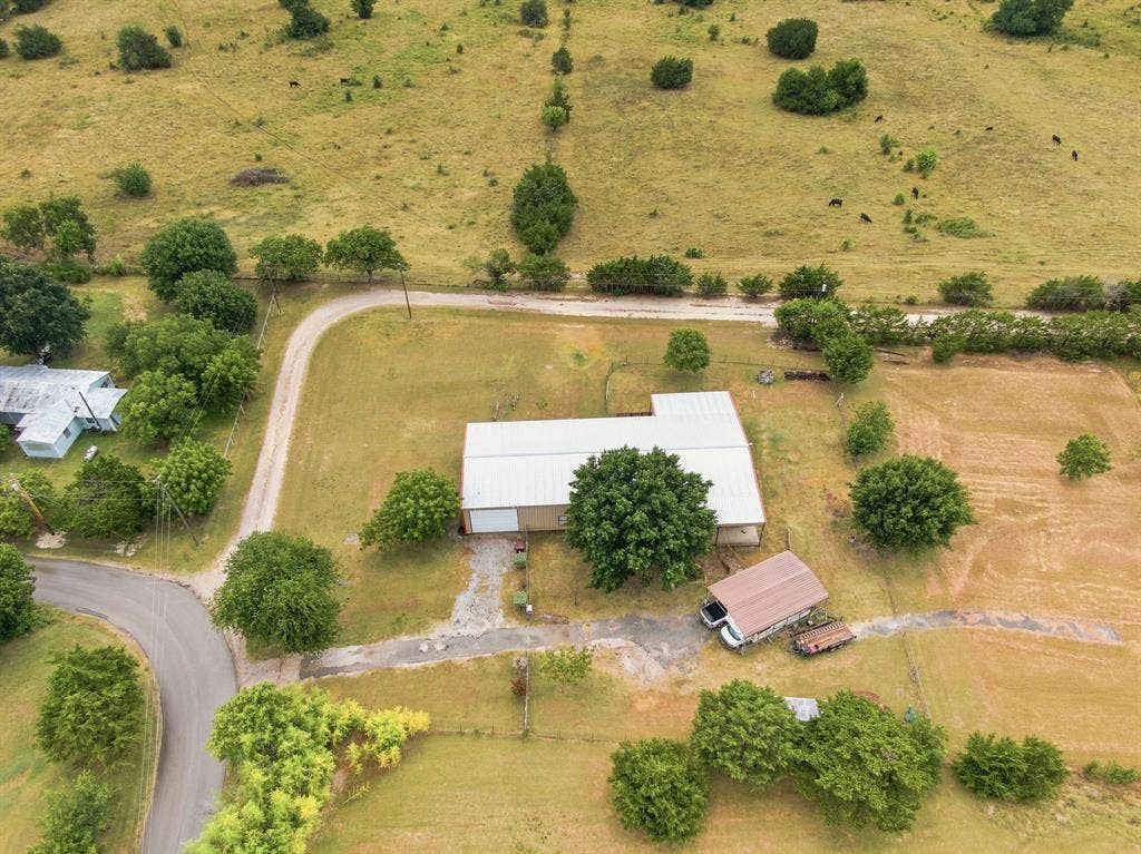 Notice large carport for RV and autos.