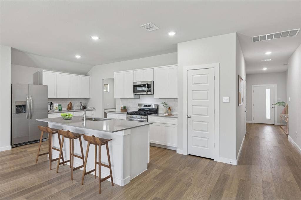 2022 Chariot Court, Seagoville, TX 75159 Kitchen in the Harrison home plan by Trophy Signature Homes – REPRESENTATIVE PHOTO