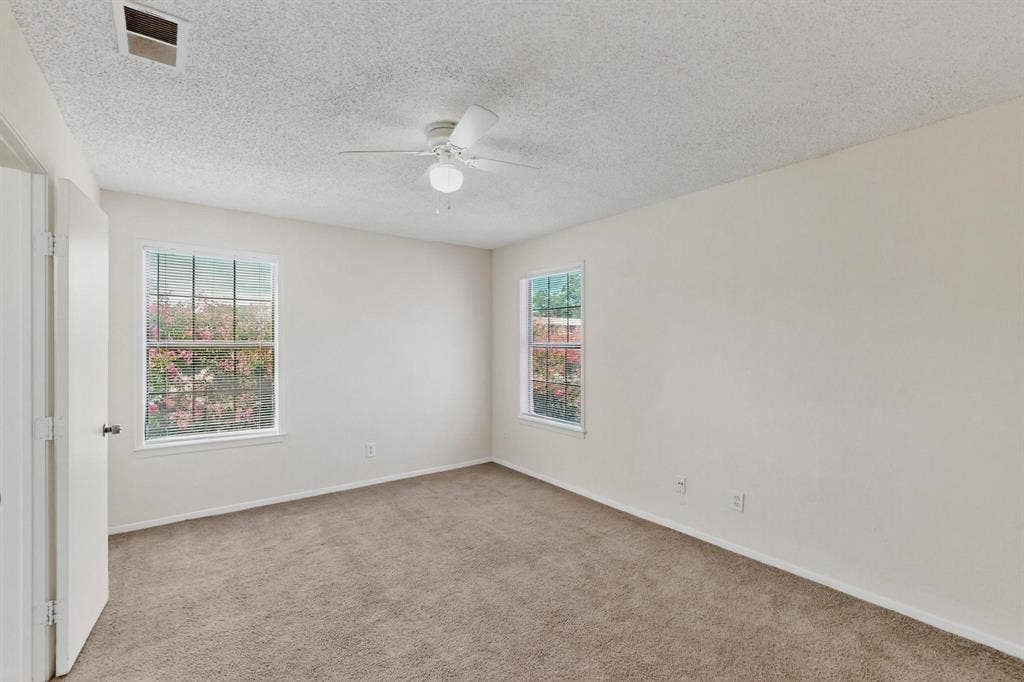 5322 Columbia Avenue, Dallas, TX 75214 Bedroom with tall windows and a ceiling fan