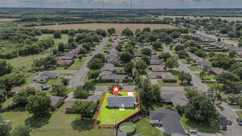 3407 Highmeadow Lane, Greenville, TX 75402 Aerial perspective showcasing the property within a residential neighborhood