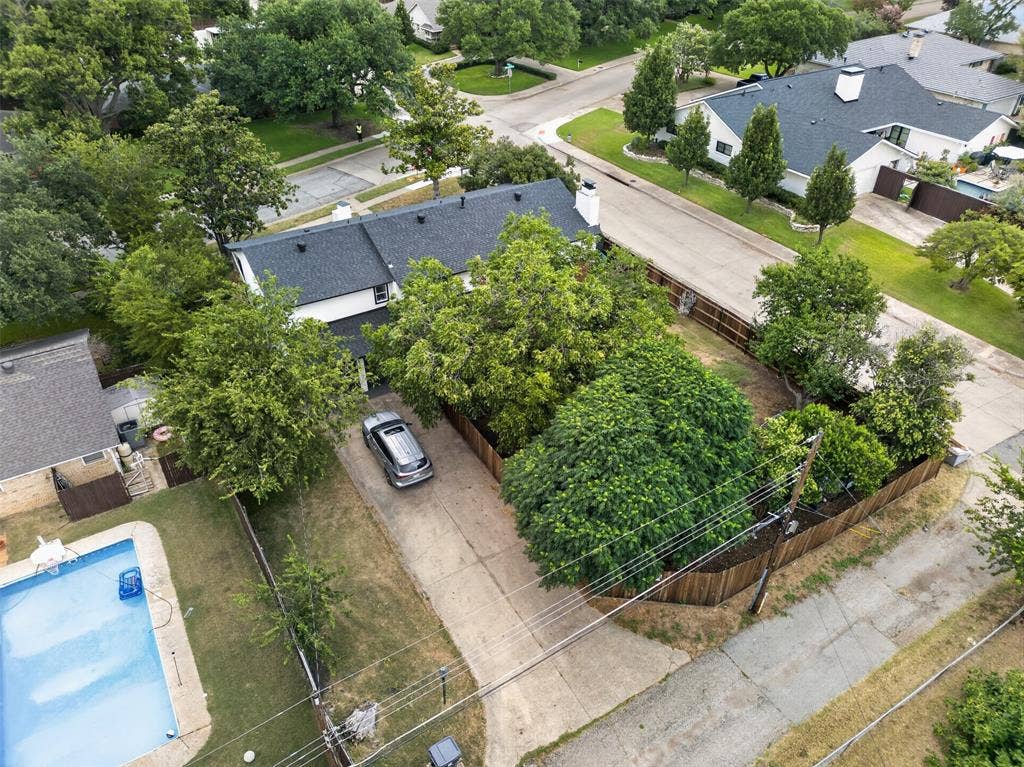 4064 High Summit Drive, Dallas, TX 75244 Treed back yard with rear entry garage.