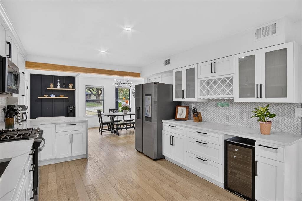 4064 High Summit Drive, Dallas, TX 75244 Updated kitchen. Stainless appliances and wine cooler.