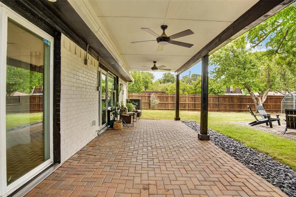 4064 High Summit Drive, Dallas, TX 75244 Large covered back patio with 2 ceiling fans.