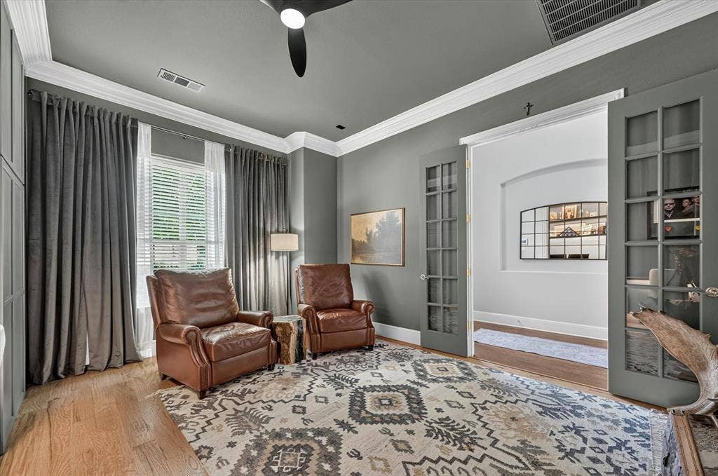 8405 Gallery Way, McKinney, TX 75072 Room featuring wood-finish flooring, paneled walls, and crown molding