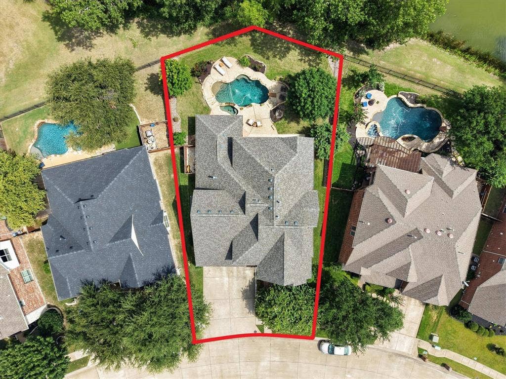 8405 Gallery Way, McKinney, TX 75072 Expansive property featuring a multi-level roofline, a private backyard pool, integrated spa, surrounding patio, and mature landscaping