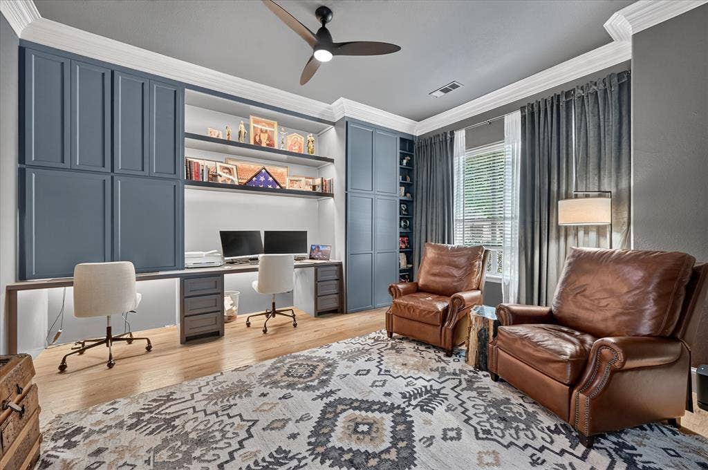 8405 Gallery Way, McKinney, TX 75072 Custom built-in desk with undermount lighting, wood-finish flooring, recessed shelving, extensive cabinetry, and crown molding