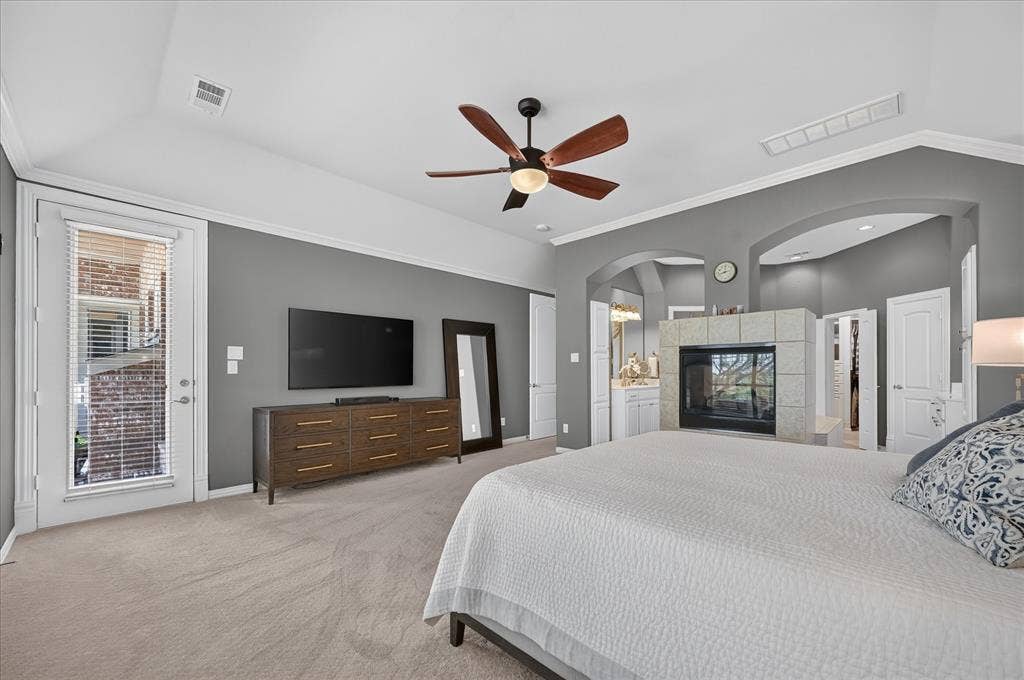 8405 Gallery Way, McKinney, TX 75072 Spacious room featuring a stone-clad fireplace and a private exterior door