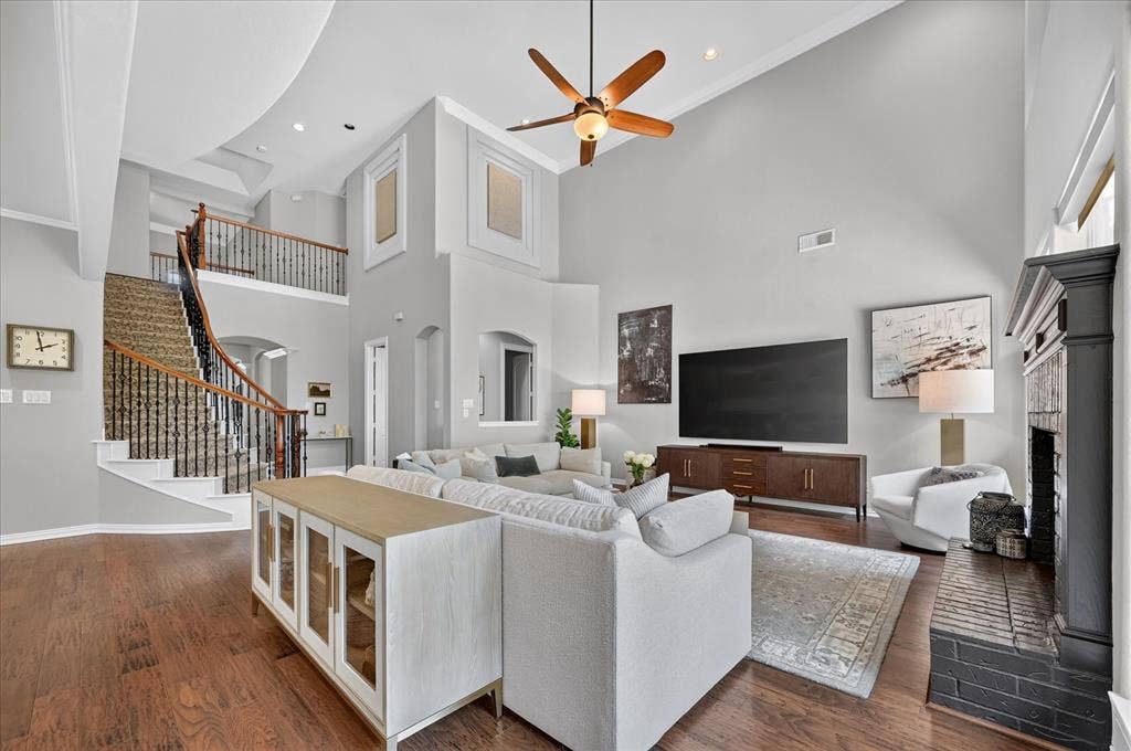 8405 Gallery Way, McKinney, TX 75072 Grand entryway with a curved staircase featuring wrought iron balusters