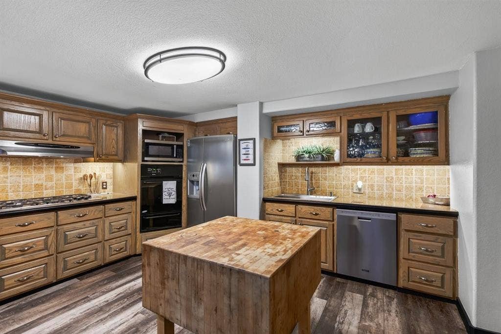 18251 Rocky Point Run, Mabank, TX 75156 Island kitchen has a full wall of pantry space also with lots of storage.