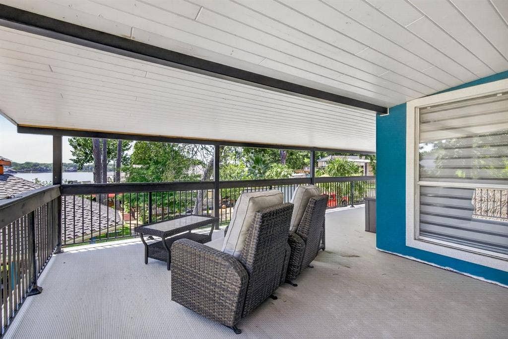 18251 Rocky Point Run, Mabank, TX 75156 This covered balcony patio space is off of the upstairs primary suite.