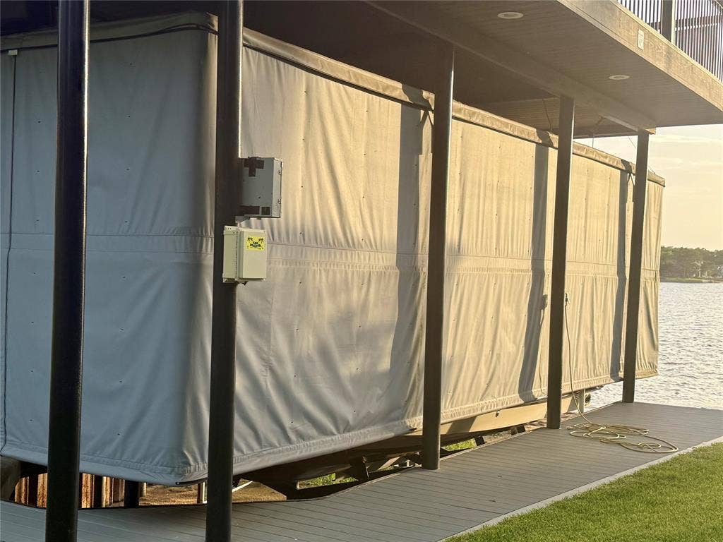 18251 Rocky Point Run, Mabank, TX 75156 Boat house has composite surface, aluminum party deck and full touchless cover.