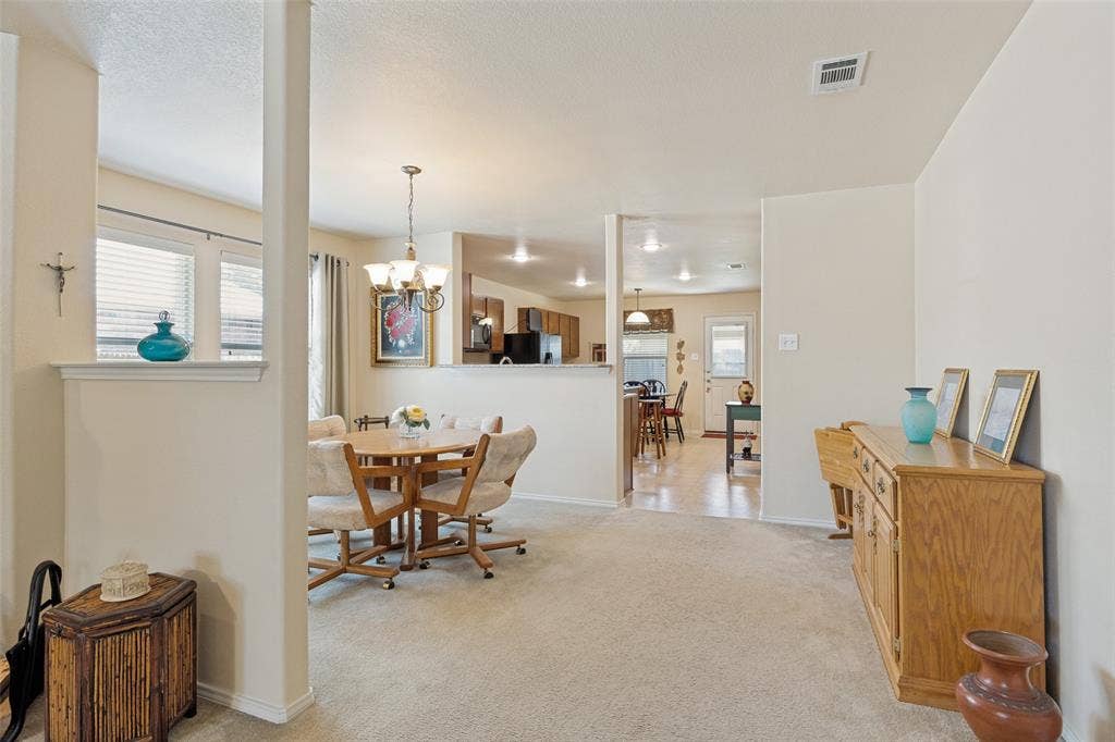 317 Amethyst Drive, Fort Worth, TX 76131 Carpeted living area with neutral wall tones