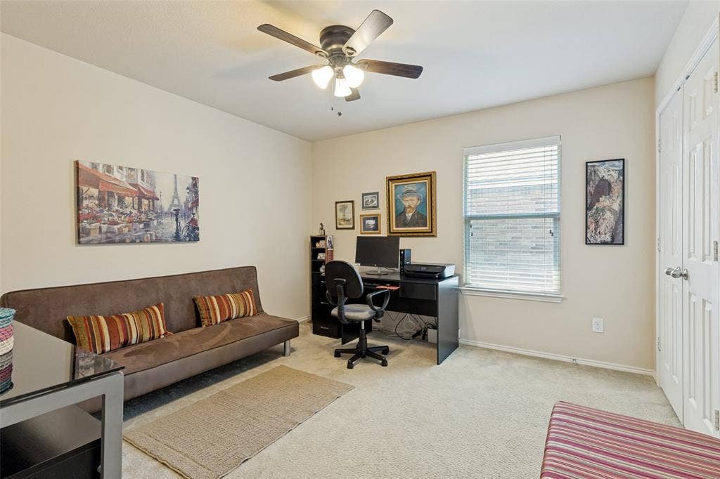 317 Amethyst Drive, Fort Worth, TX 76131 Carpeted room featuring a ceiling fan with integrated lighting, a window with blinds, and a paneled door