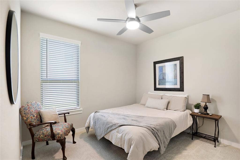 919 Edgehurst Drive, Princeton, TX 75071 Room featuring a modern ceiling fan with integrated lighting, a window with horizontal blinds, and neutral-toned wall paint