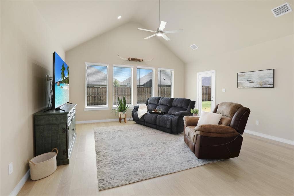 919 Edgehurst Drive, Princeton, TX 75071 Vaulted ceiling great room featuring wood-finish flooring, recessed lighting, and a ceiling fan