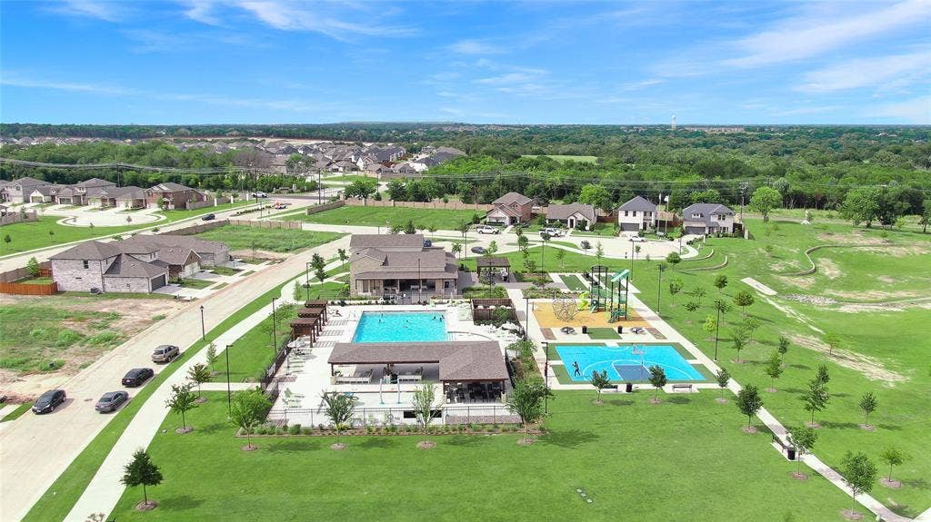 919 Edgehurst Drive, Princeton, TX 75071 Community recreation area featuring an outdoor swimming pool, covered lounge areas, a playground, and a basketball court