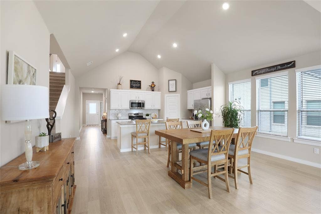919 Edgehurst Drive, Princeton, TX 75071 Open-concept living space with a vaulted ceiling and recessed lighting
