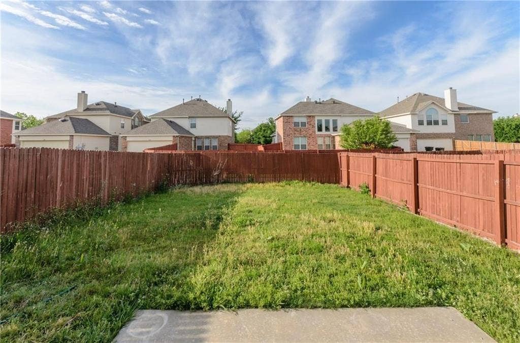 4440 Waskom Drive, Plano, TX 75024 Fenced backyard with a concrete patio pad and perimeter fencing