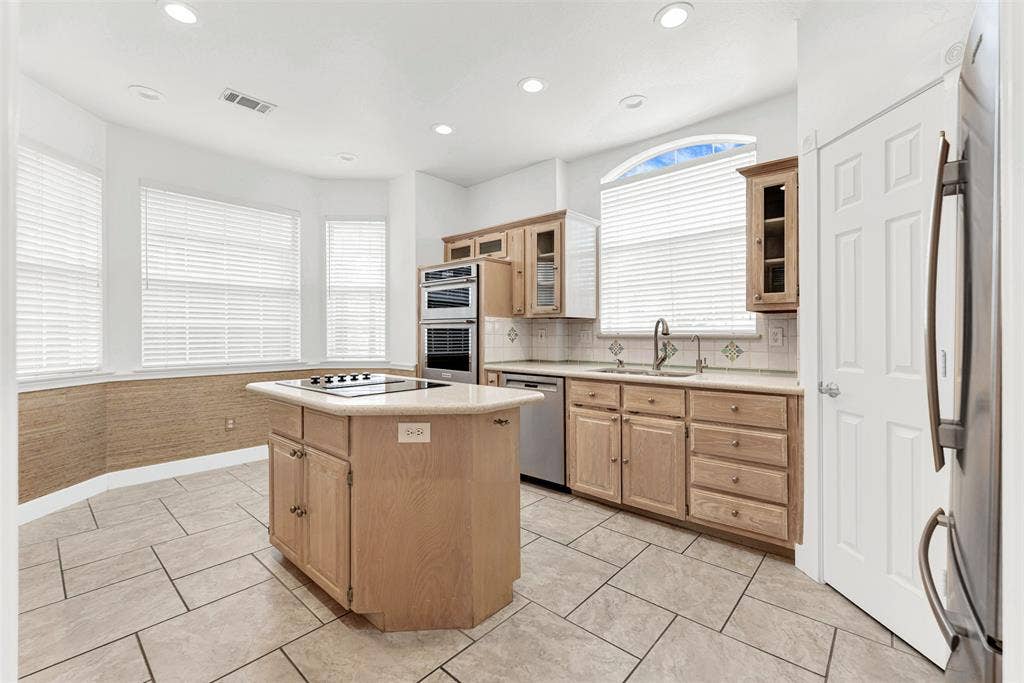 A classic bay window system floods the entire space with soft, natural light. It is easy to envision a quiet morning coffee routine here while watching the sun rise.