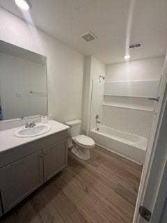 2402 Hesperus Avenue, Crandall, TX 75114 Bathroom featuring a single vanity with storage, wood-finish flooring, recessed lighting, and a combination tub and shower
