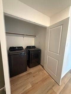 2402 Hesperus Avenue, Crandall, TX 75114 Laundry closet with wood-finish flooring, white walls, and a built-in hanging rod