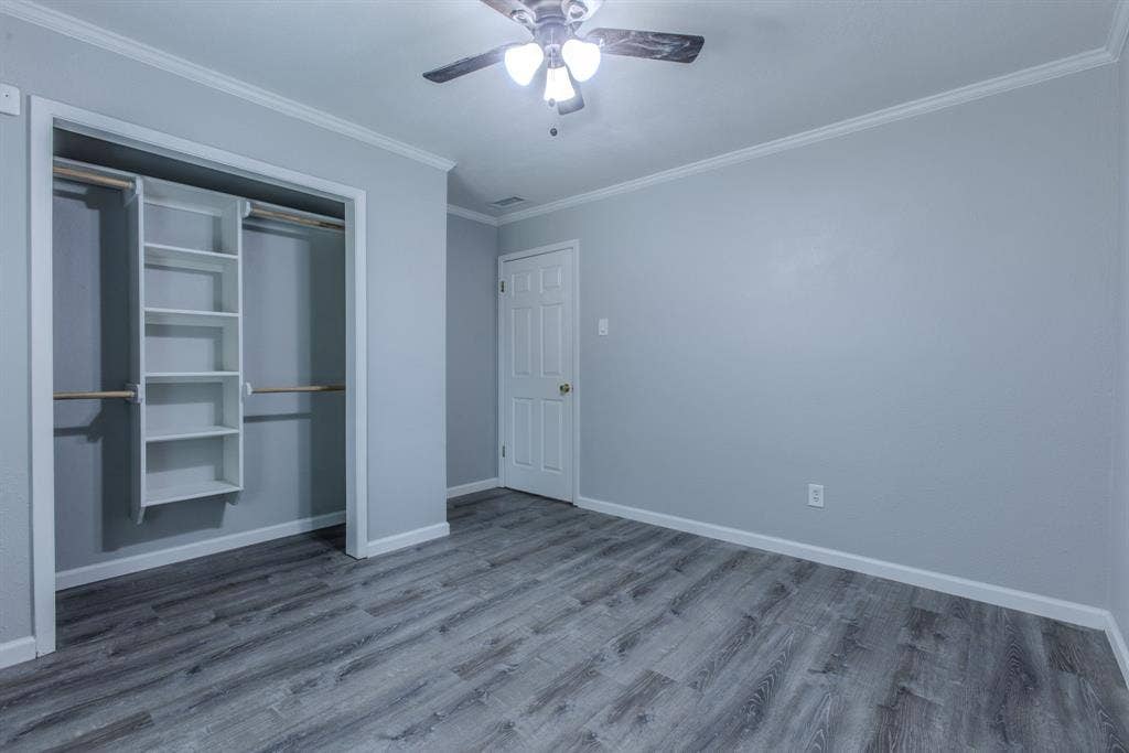 Interior space featuring wood-finish flooring and light gray walls