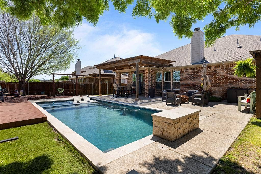 12012 Tobosa Circle, McKinney, TX 75071 View of swimming pool with a deck and a pergola