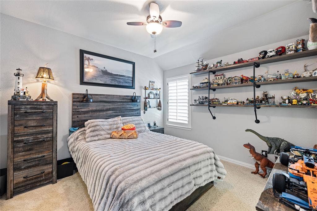 12012 Tobosa Circle, McKinney, TX 75071 Bedroom with ceiling fan and light carpet