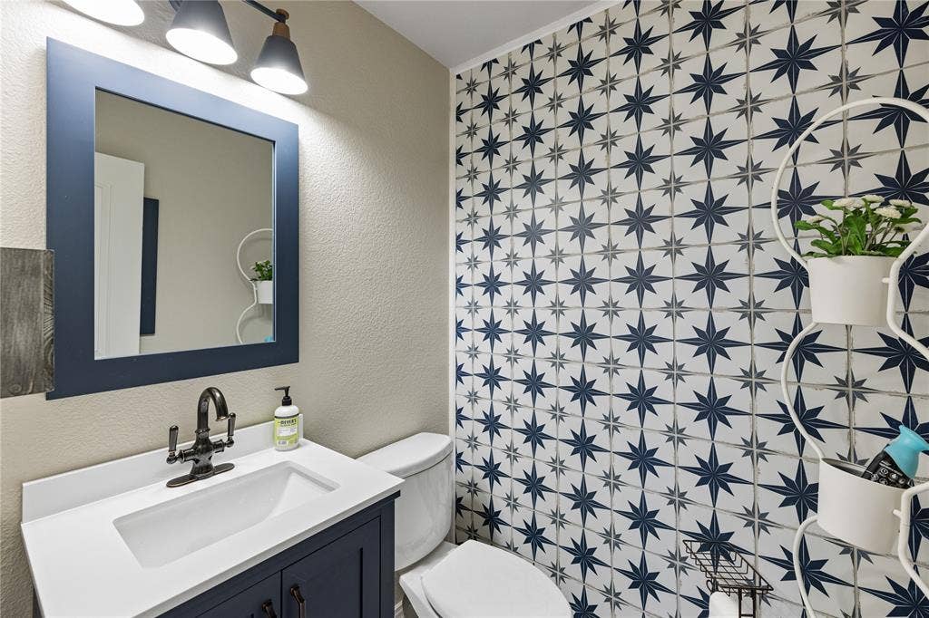 12012 Tobosa Circle, McKinney, TX 75071 Bathroom featuring oversized vanity, toilet, and tile flooring