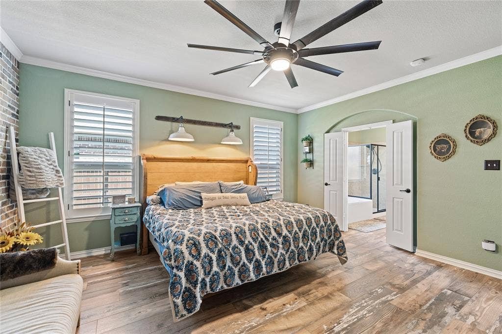 12012 Tobosa Circle, McKinney, TX 75071 Bedroom featuring ceiling fan, crown molding, and hardwood / wood-style flooring