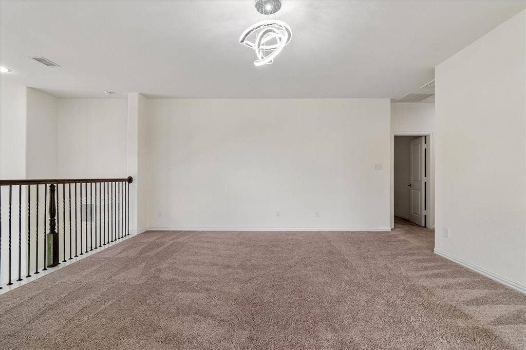 1650 Chisholm Trail, Prosper, TX 75078 Spacious open area featuring plush brown carpeting and crisp white walls