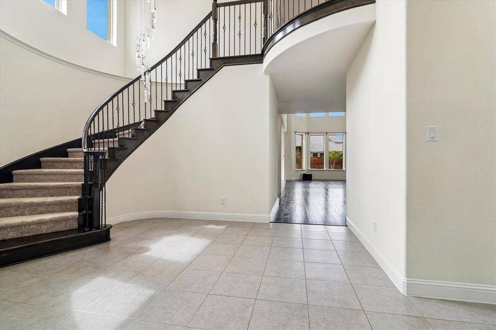 1650 Chisholm Trail, Prosper, TX 75078 Grand Foyer with circular staircase.