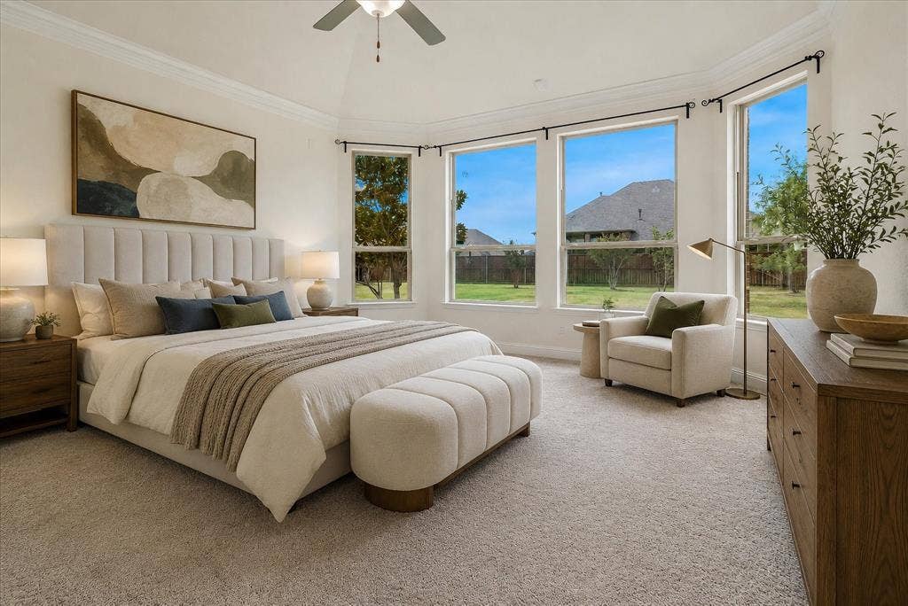 1650 Chisholm Trail, Prosper, TX 75078 Spacious bedroom with bay windows, vaulted ceiling, crown molding, and neutral-tone carpeting