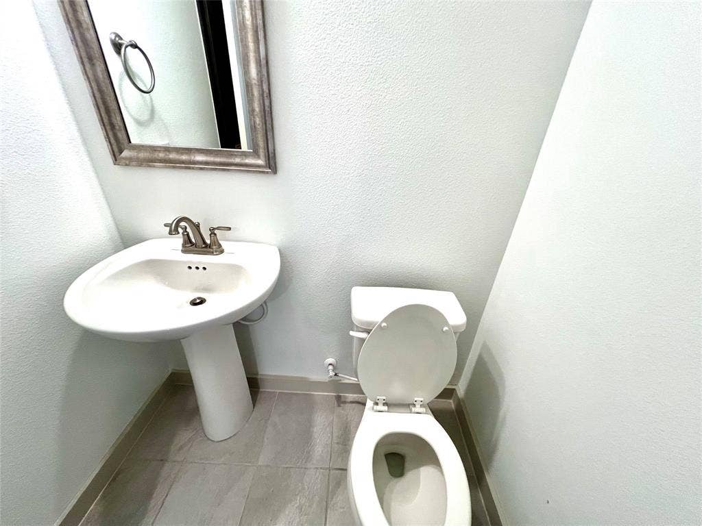 1755 Montgomery Drive, Plano, TX 75075 Bathroom featuring toilet
