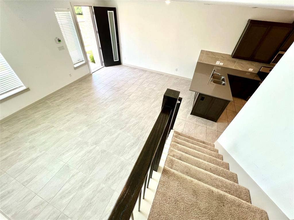 1755 Montgomery Drive, Plano, TX 75075 Living room featuring sink and light tile patterned flooring