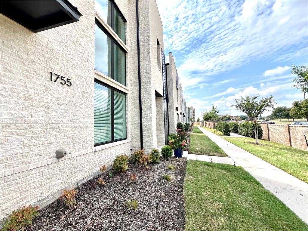 1755 Montgomery Drive, Plano, TX 75075 View of home's exterior with a lawn