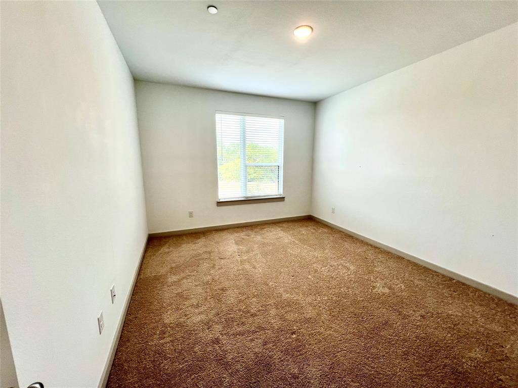 1755 Montgomery Drive, Plano, TX 75075 Unfurnished room featuring carpet