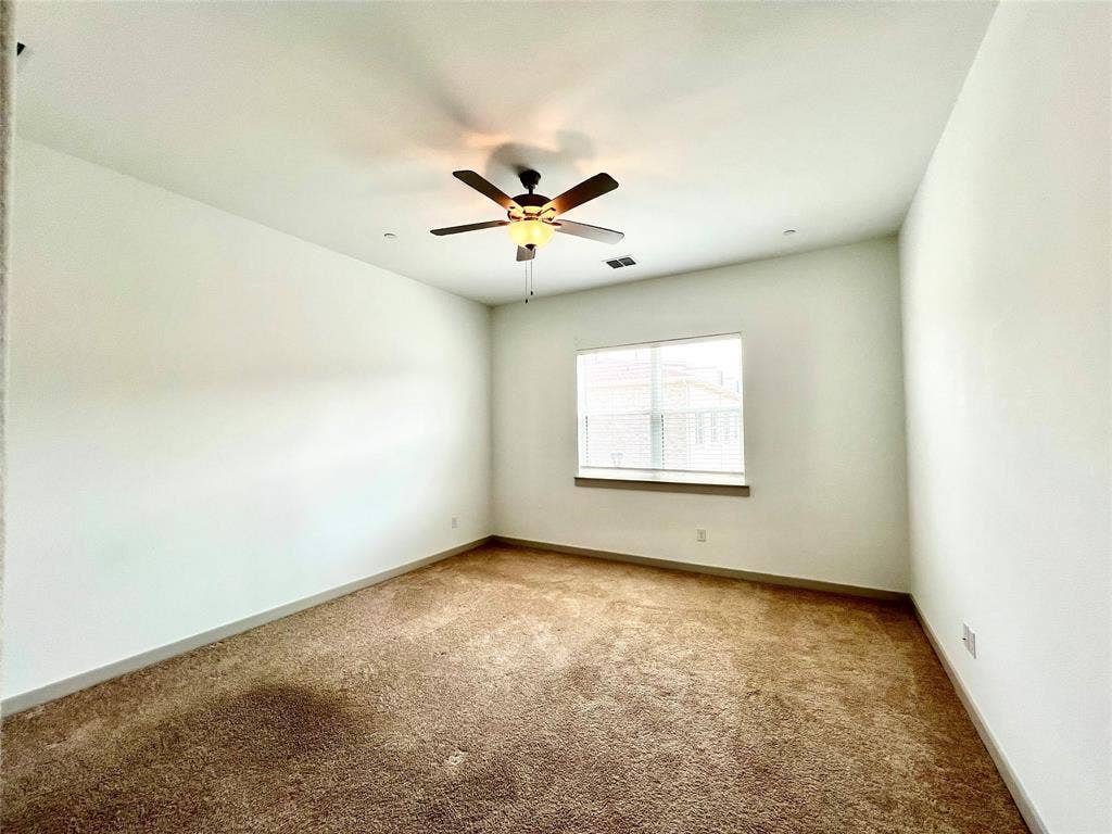 1755 Montgomery Drive, Plano, TX 75075 Carpeted empty room featuring ceiling fan