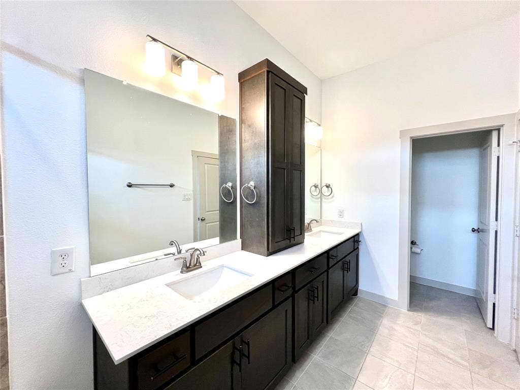 1755 Montgomery Drive, Plano, TX 75075 Bathroom featuring tile patterned floors and vanity