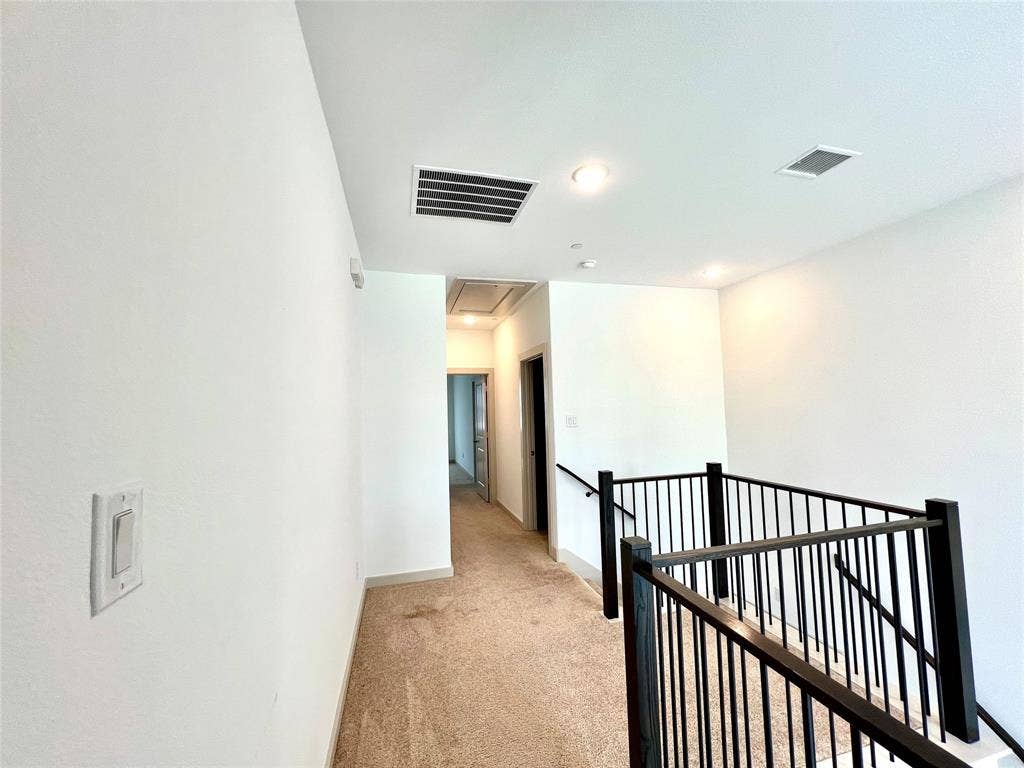 1755 Montgomery Drive, Plano, TX 75075 Hallway with light colored carpet