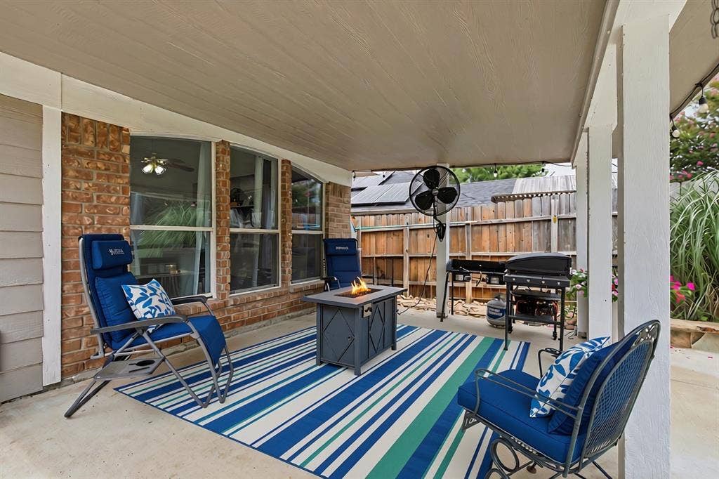 600 Crystal Falls Drive, McKinney, TX 75071 with rug and cushions