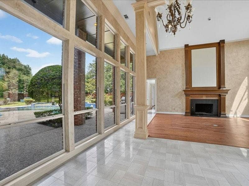 5201 Windjammer Road, Plano, TX 75093 Soaring ceilings and expansive windows frame the exterior landscaping