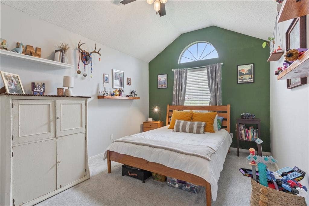 10308 Eagle Mountain Drive, Waco, TX 76712 Interior room featuring a vaulted ceiling and an arched transom window