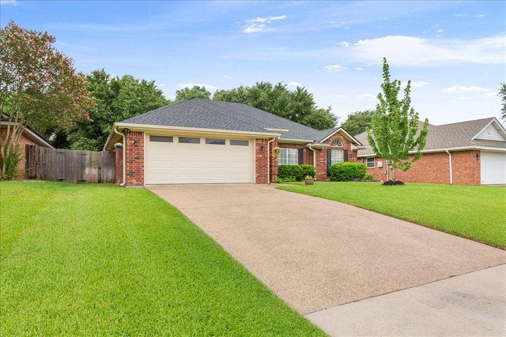 10308 Eagle Mountain Drive, Waco, TX 76712 Brick exterior with an attached two-car garage