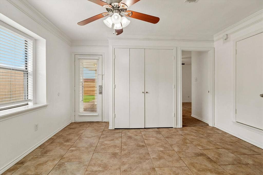 3318 Wells Drive, Plano, TX 75093 Room featuring ceramic tile flooring, a ceiling fan with integrated lighting, and crown molding